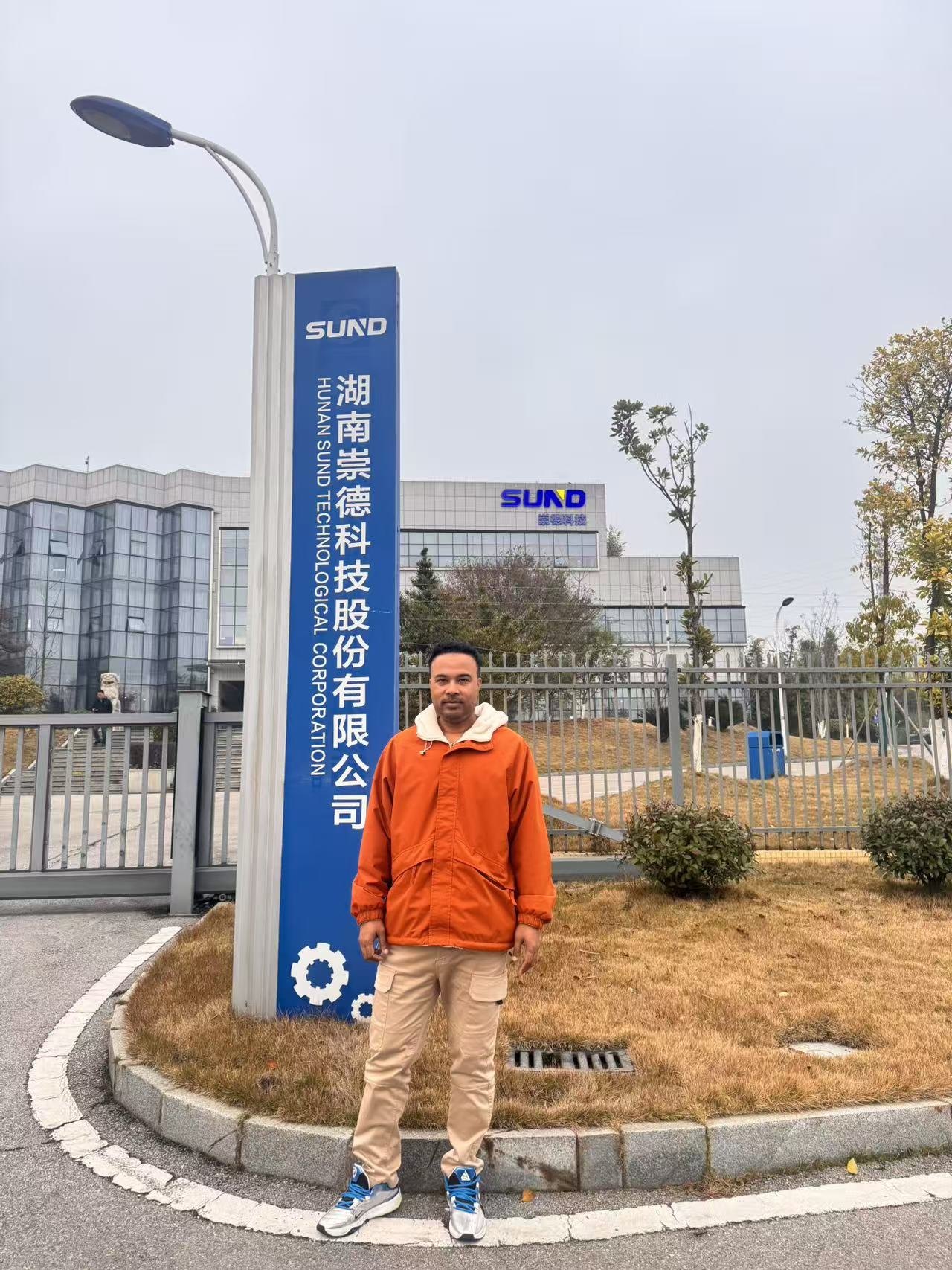 Swiftpath representative outside a Chinese industrial OEM during CCPP bearing project factory visit